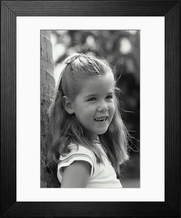 Framed Print : Vintage Photograph. Head of a little girl smiling Framed Print : Vintage Photograph. Head of a little girl smiling