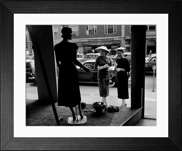 Framed Print : Women looking at window display Framed Print : Women looking at window display
