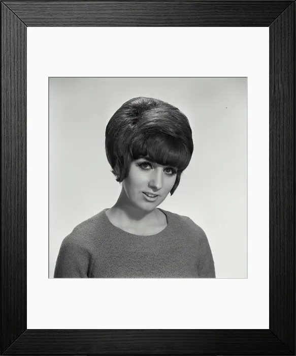 Framed Print : Vintage Photograph. Woman in sweater on blank background looking at camera Framed Print : Vintage Photograph. Woman in sweater on blank background looking at camera