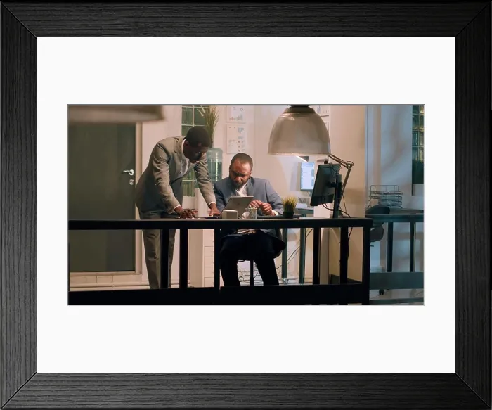 Framed Print : Employee helps coworker solve tasks Framed Print : Employee helps coworker solve tasks