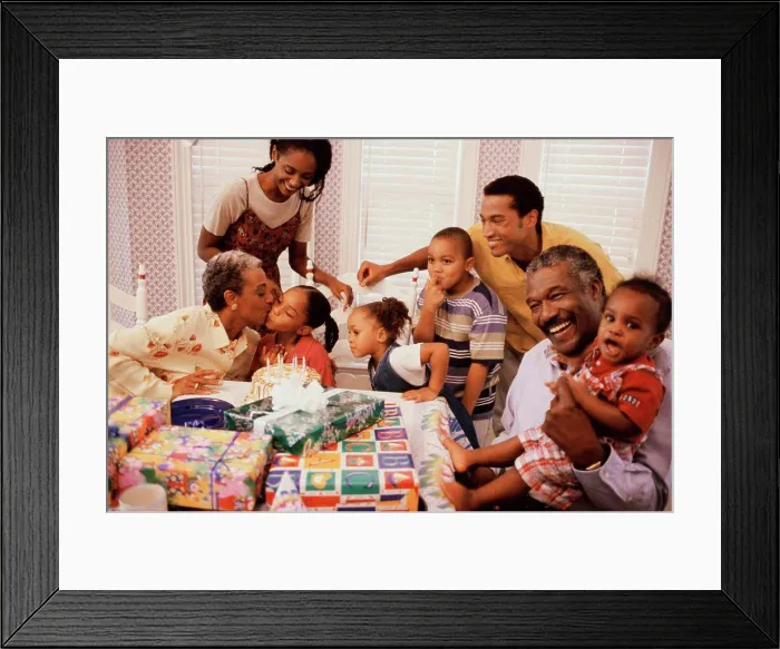 Framed Print : Family celebrating a birthday party Framed Print : Family celebrating a birthday party