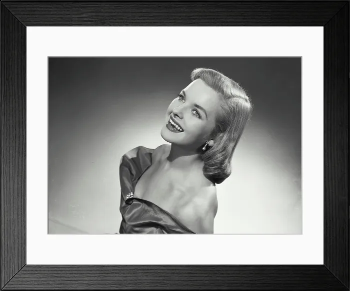 Framed Print : Vintage photograph. Portrait of woman in strapless dress smiling off camera Framed Print : Vintage photograph. Portrait of woman in strapless dress smiling off camera