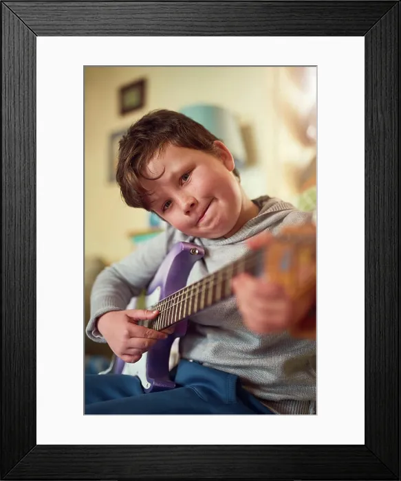 Framed Print : Boy, electric guitar and portrait in home for music or performance Framed Print : Boy, electric guitar and portrait in home for music or performance