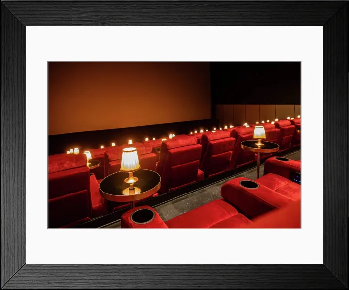 Framed Print : Hjorring, Denmark June 7, 2025 The plush interior of a cinema with seats, table lamps, and tables Framed Print : Hjorring, Denmark June 7, 2025 The plush interior of a cinema with seats, table lamps, and tables