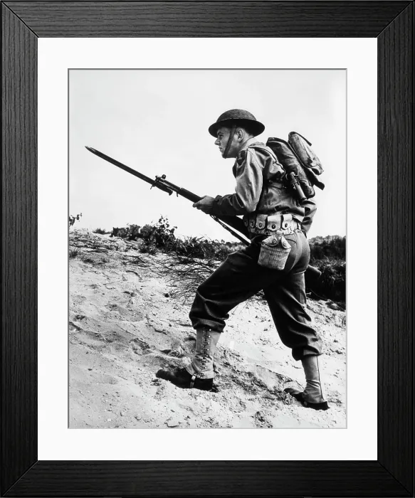 Framed Print : 1940S 1942 World War Ii Soldier Walking Across Rough Terrain With Rifle And Bayonet In Hand Framed Print : 1940S 1942 World War Ii Soldier Walking Across Rough Terrain With Rifle And Bayonet In Hand