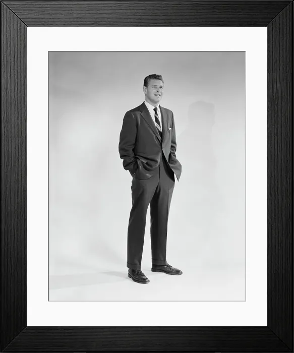 Framed Print : 1950S 1960S Portrait Smiling Man Standing With Hands In Pockets Wearing Suit And Tie Framed Print : 1950S 1960S Portrait Smiling Man Standing With Hands In Pockets Wearing Suit And Tie