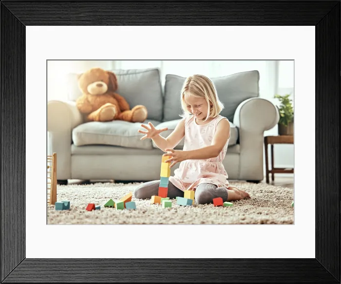 Framed Print : Kid, playing alone and toys on living room floor Framed Print : Kid, playing alone and toys on living room floor