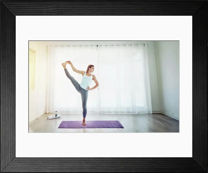 Framed Print : Yoga, woman and stretching leg in home on mat with balance