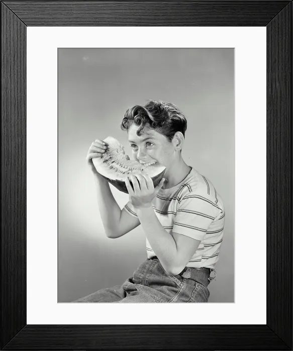 Framed Print : Vintage photograph. Boy smiling eating watermelon Framed Print : Vintage photograph. Boy smiling eating watermelon