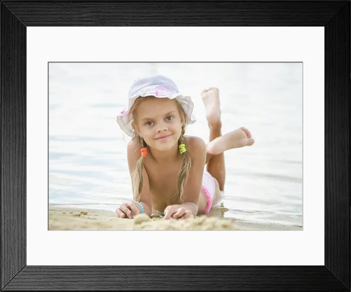 Framed Print : Six year old girl lying on the sand on the beach Six year old girl Europeans in panama lying on his stomach on the sand Framed Print : Six year old girl lying on the sand on the beach Six year old girl Europeans in panama lying on his stomach on the sand