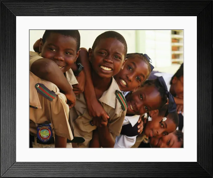 Framed Print : Barbados, Farmers, close-up of African schoolchildren smiling, standing one behind another, wearing school uniform (MR)