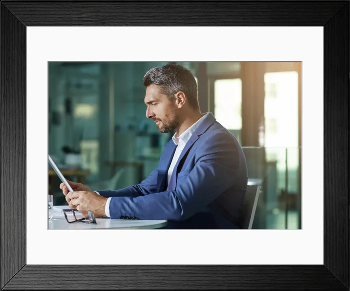Framed Print : Businessman, investing or accountant with tablet for finance news and budget planning in office Framed Print : Businessman, investing or accountant with tablet for finance news and budget planning in office
