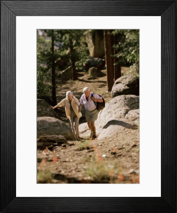 Framed Print : Senior couple hiking