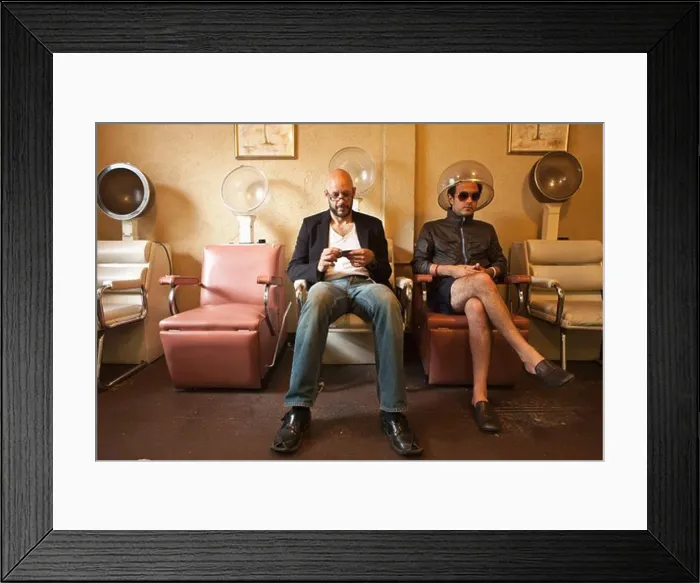 Framed Print : Two men sitting in old salon hair drying chairs Framed Print : Two men sitting in old salon hair drying chairs
