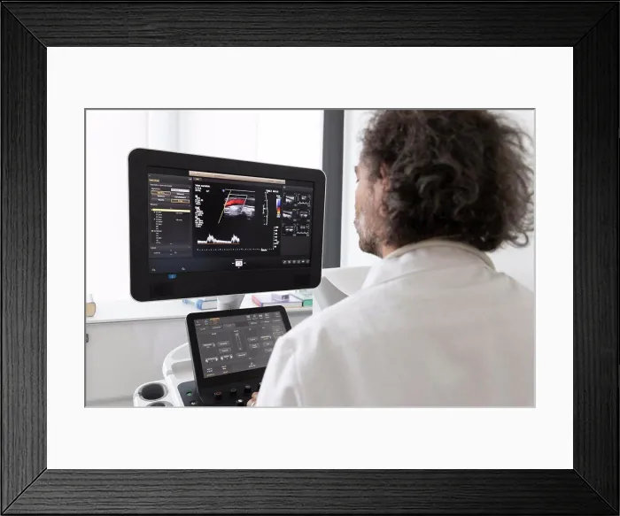 Framed Print : a neurologist gives an ultrasound to a patient Framed Print : a neurologist gives an ultrasound to a patient