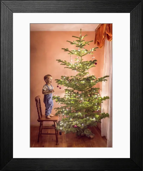 Framed Print : little boy in awe looking at christmas tree for the first time Framed Print : little boy in awe looking at christmas tree for the first time