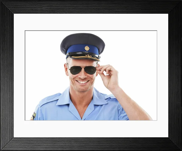 Framed Print : Police officer man in sunglasses isolated on a white background Framed Print : Police officer man in sunglasses isolated on a white background