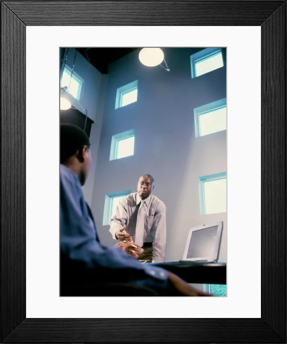 Framed Print : Two businessmen talking in an office Framed Print : Two businessmen talking in an office