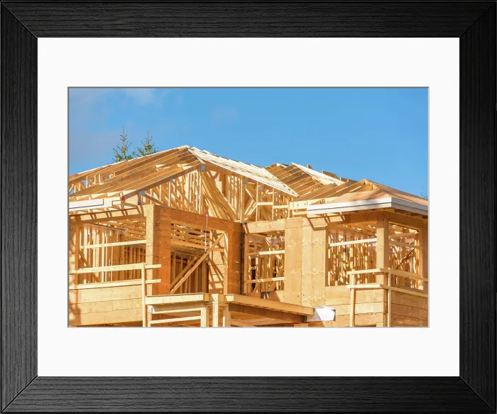 Framed Print : New apartment building under construction on sunny day on blue sky background