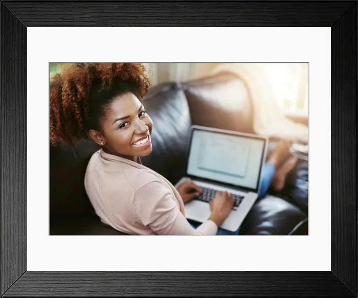Framed Print : Woman, portrait or happy with laptop on sofa for internet browsing Framed Print : Woman, portrait or happy with laptop on sofa for internet browsing