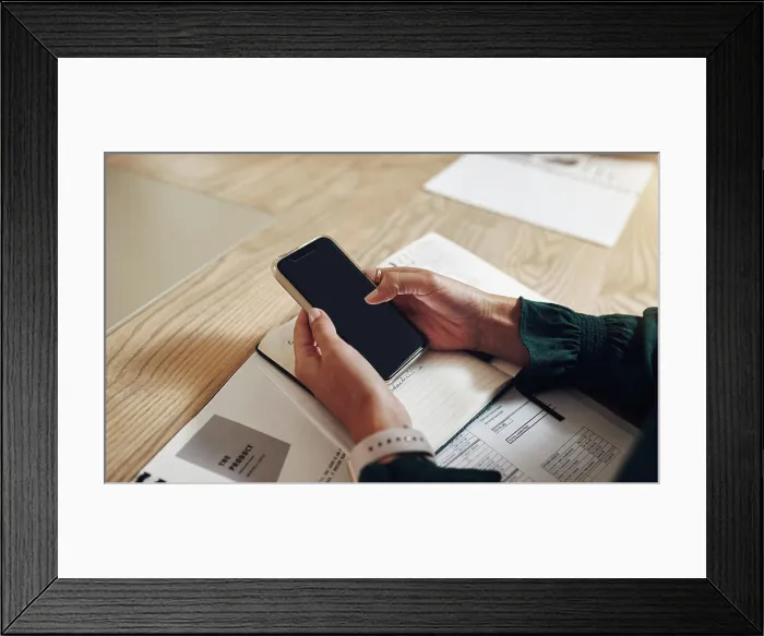 Framed Print : Hands, notebook and phone with business person at table in boardroom of office for meeting or planning Framed Print : Hands, notebook and phone with business person at table in boardroom of office for meeting or planning