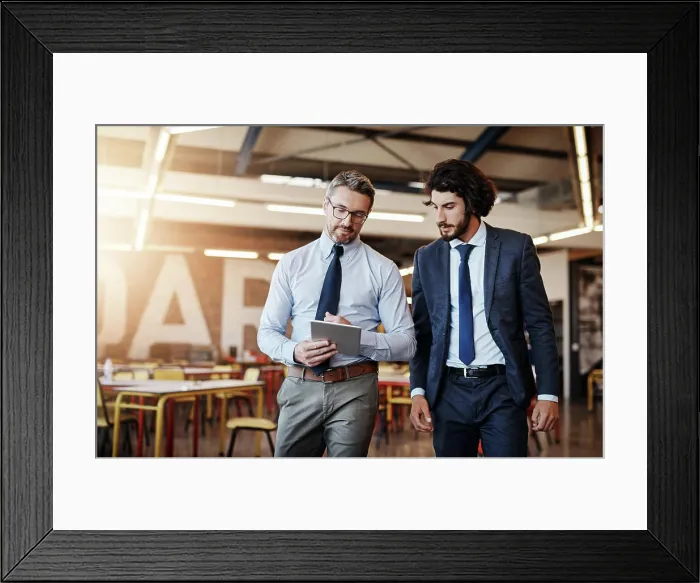 Framed Print : Business people, tablet and talking or walking in office with discussion for project management and client briefing