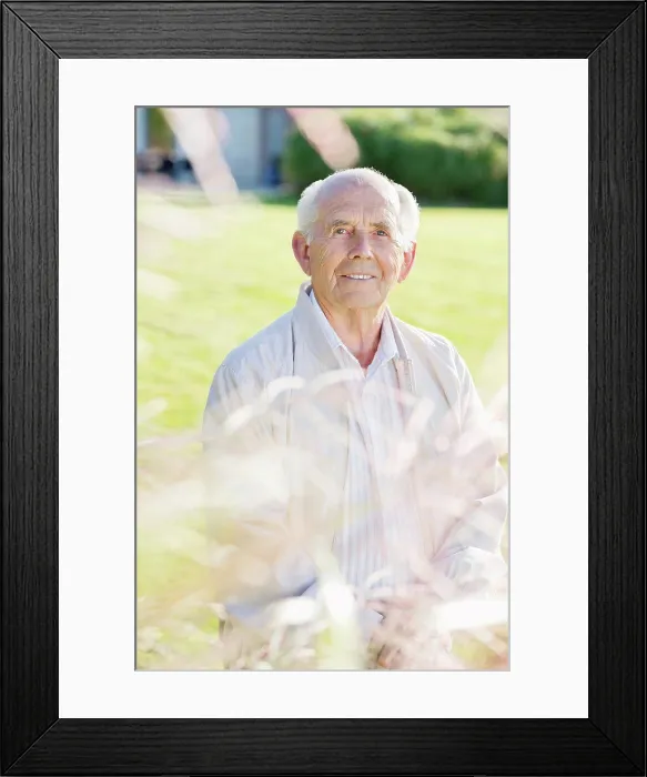 Framed Print : Older man standing in backyard, East Grinstead, UK