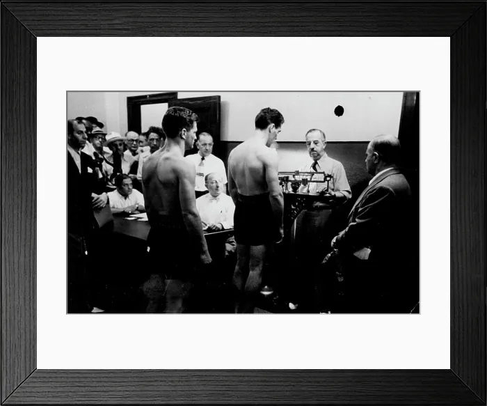 Framed Print : Weighing-time at the N.Y. State Athletic Commission is 12 noon. An official does the job. April 01, 1949