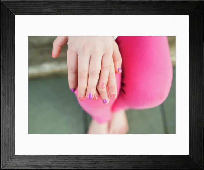 Framed Print : Overhead view of young girl showing painted nails Framed Print : Overhead view of young girl showing painted nails