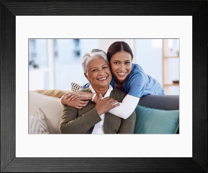 Framed Print : Portrait, smile and nurse hug old woman in retirement house Framed Print : Portrait, smile and nurse hug old woman in retirement house