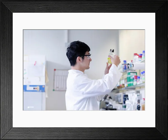Framed Print : young scientist male chinese working in laboratory Framed Print : young scientist male chinese working in laboratory
