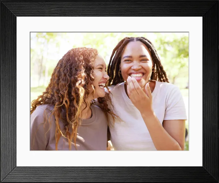 Framed Print : Young women and friends with funny joke laugh together in park for bonding Framed Print : Young women and friends with funny joke laugh together in park for bonding
