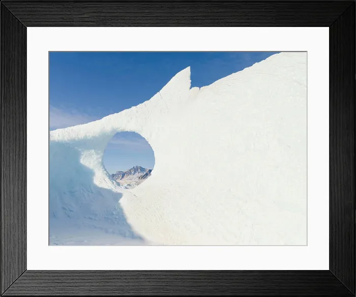 Framed Print : Icebergs frozen into the sea ice of the Uummannaq fjord system during winter. Greenland, Danish Territory Framed Print : Icebergs frozen into the sea ice of the Uummannaq fjord system during winter. Greenland, Danish Territory
