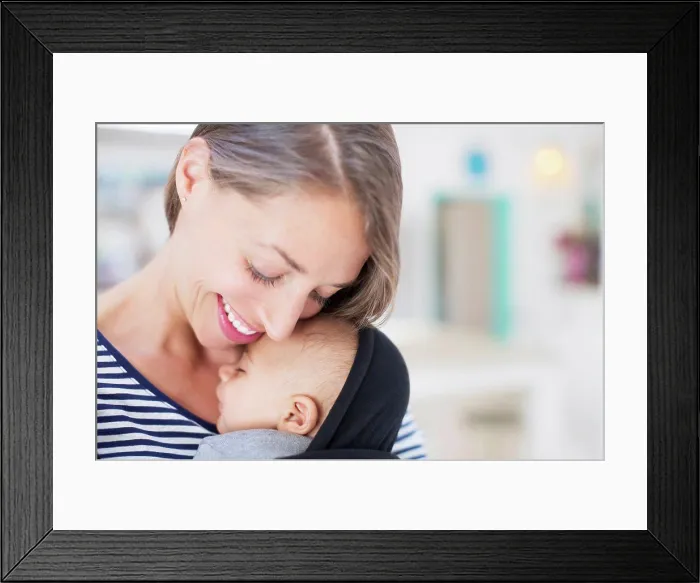 Framed Print : Mother holding sleeping baby boy, London, UK Framed Print : Mother holding sleeping baby boy, London, UK