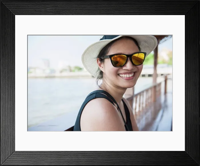 Framed Print : Woman taking a river cruise on Bangkok's Chao Phraya river Framed Print : Woman taking a river cruise on Bangkok's Chao Phraya river