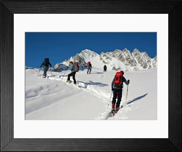 Framed Print : A group of ski tourers at Roger´s Pass heading towards the Swiss Peaks, Glacier National Park, BC