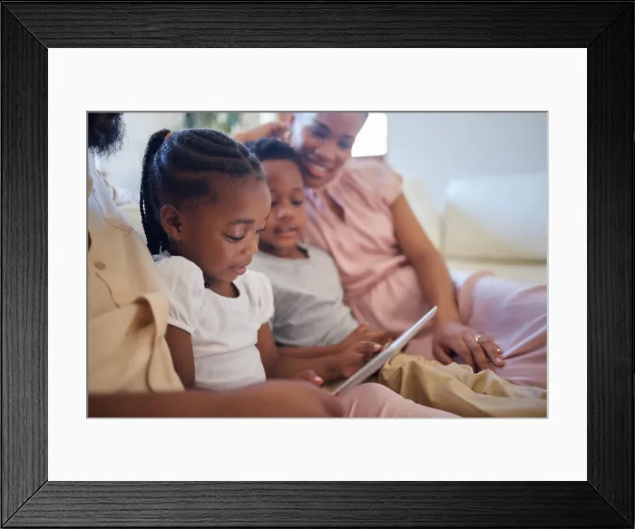 Framed Print : Tablet, girl child and ebook in living room on weekend for live streaming or storytelling for mom and dad