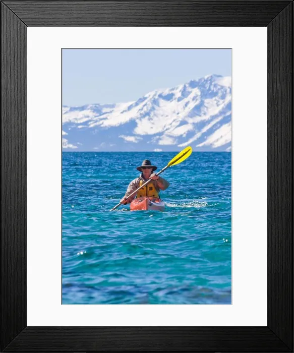 Framed Print : A man sea kayaking on Lake Tahoe near Incline Village in Nevada Framed Print : A man sea kayaking on Lake Tahoe near Incline Village in Nevada