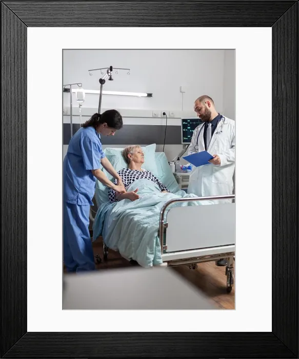 Framed Print : Senior woman laying in hospital bed receiving medication through an intravenous line Framed Print : Senior woman laying in hospital bed receiving medication through an intravenous line