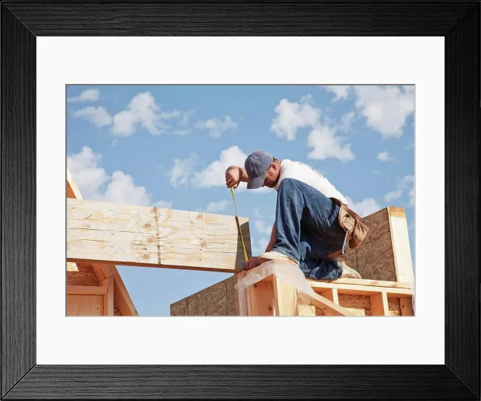 Framed Print : tradesman working on framing for new home construction, st. albert alberta canada Framed Print : tradesman working on framing for new home construction, st. albert alberta canada