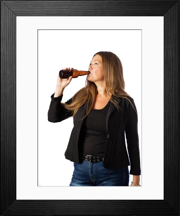 Framed Print : Taking a sip of beer Isolated portrait of a forty year old woman in a sport coat taking a sip from a brown beer bottle Framed Print : Taking a sip of beer Isolated portrait of a forty year old woman in a sport coat taking a sip from a brown beer bottle