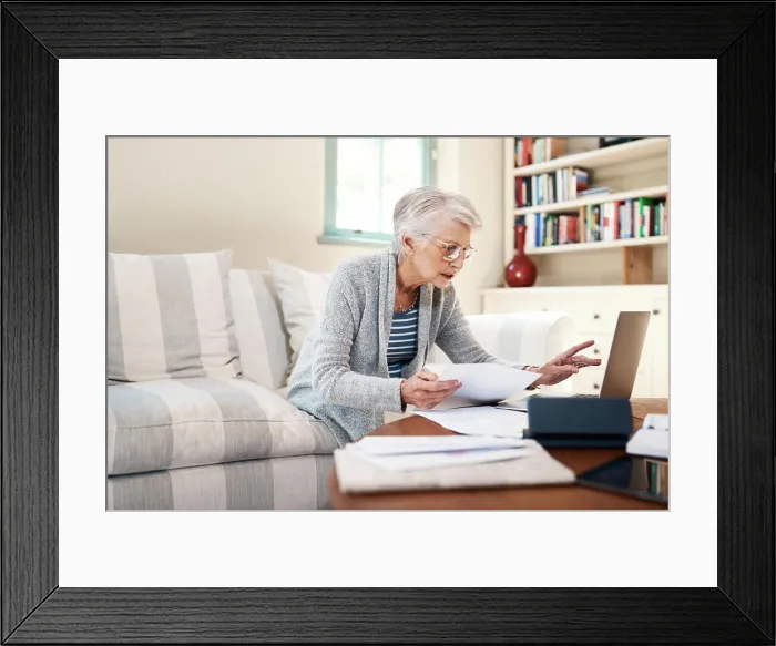 Framed Print : Senior woman, paperwork and laptop for insurance in home Framed Print : Senior woman, paperwork and laptop for insurance in home