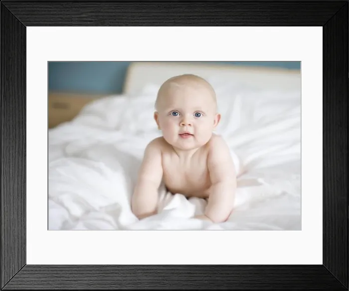 Framed Print : Portrait of a baby lying in a bed, Sweden