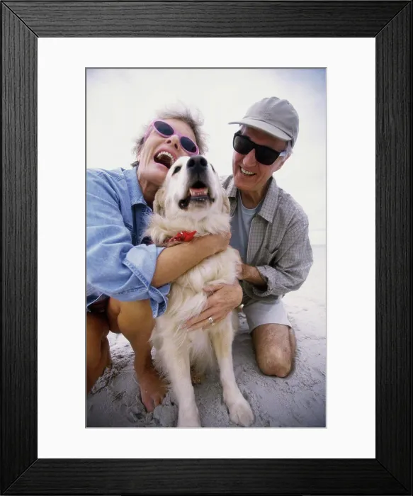Framed Print : Senior couple hugging their dog Framed Print : Senior couple hugging their dog