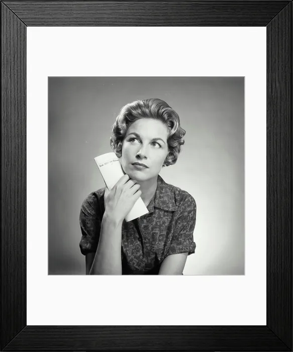 Framed Print : Close-up of a mid adult woman thinking Framed Print : Close-up of a mid adult woman thinking
