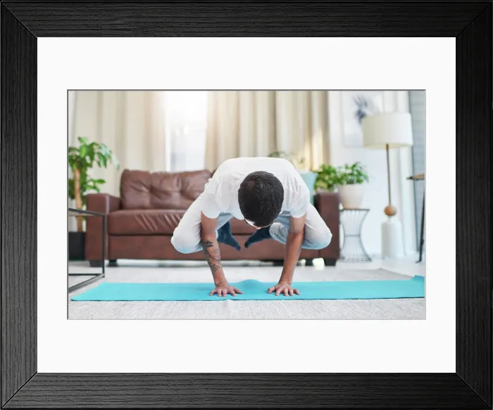 Framed Print : Balance, power and strength with man in living room of apartment for development or holistic fitness Framed Print : Balance, power and strength with man in living room of apartment for development or holistic fitness