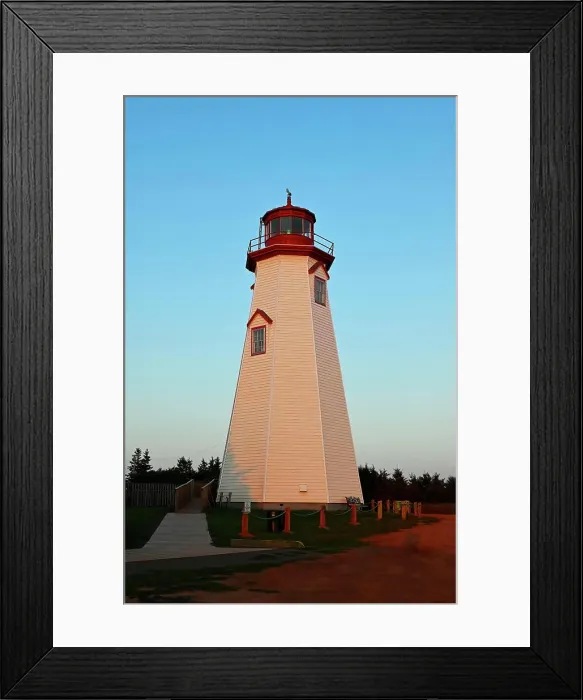 Framed Print : A vertical image of the famous tourist attraction Seacow Head Lighthouse Prince Edward Island in the evening light of