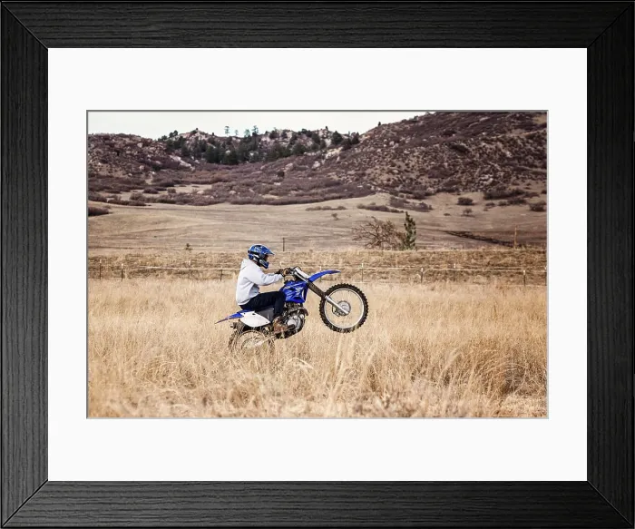 Framed Print : Young Man Dirt Biking in the Foothills in Colorado Framed Print : Young Man Dirt Biking in the Foothills in Colorado