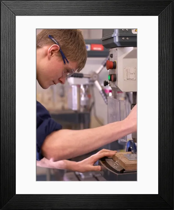 Framed Print : Worker using saw in factory Framed Print : Worker using saw in factory