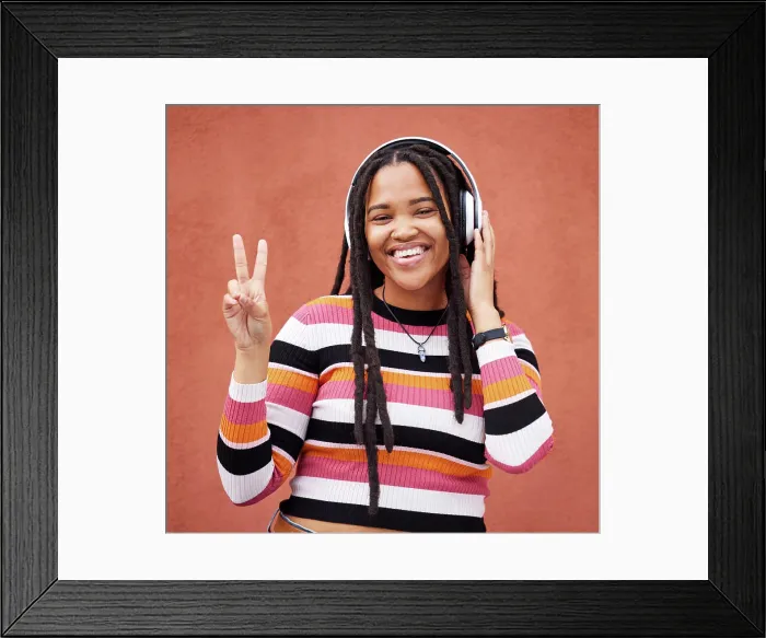 Framed Print : Portrait, headphones and black woman with peace sign isolated on orange wall for gen z music or mental health Framed Print : Portrait, headphones and black woman with peace sign isolated on orange wall for gen z music or mental health
